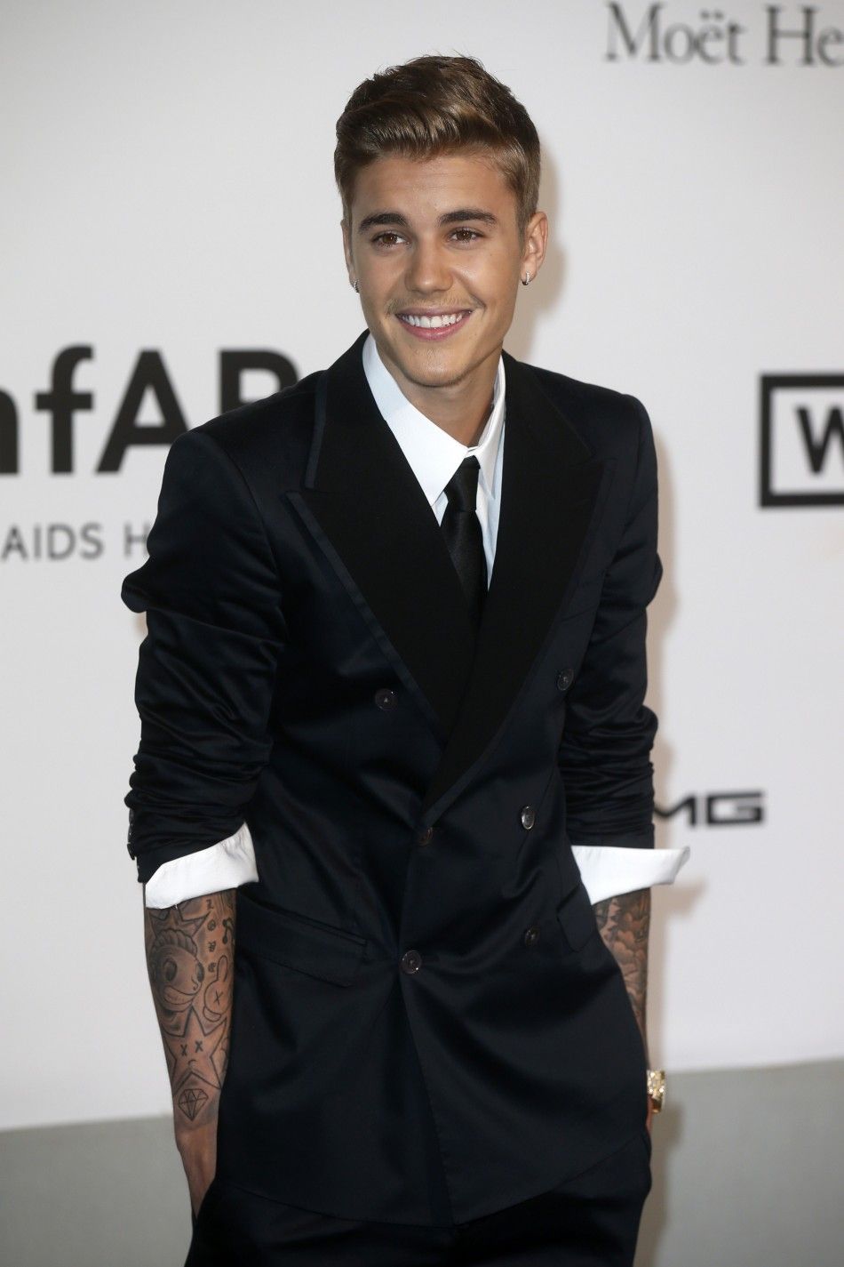 Justin Bieber Arrives for amfARs Cinema Against AIDS 2014 Event in Antibes During the 67th Cannes Film Festival