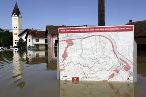 A map showing a land mine field is seen in the water during heavy floods in the village of Prud May 20, 2014. Communities in Serbia and Bosnia battled to protect towns and power plants on Monday from rising flood waters and landslides that have devastated