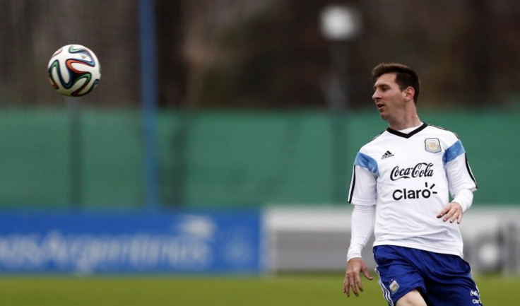 Argentina's Messi watches the ball during a training session at the squad's camp ahead of the 2014 World Cup in Buenos Aires