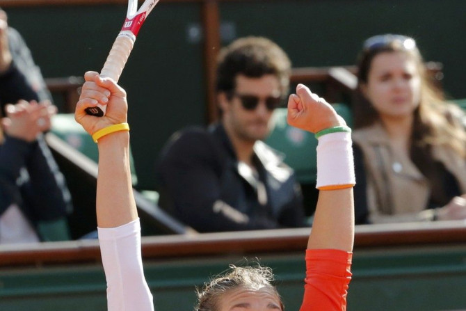 Andrea Petkovic of Germany reacts after winning her women's quarter-final match against Sara Errani of Italy at the French Open tennis tournament at the Roland Garros stadium in Paris June 4, 2014. 