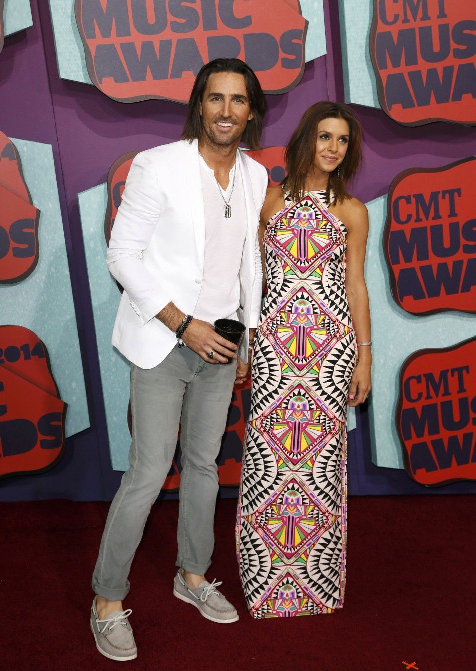Musician Jake Owen and wife Lacey Buchanan arrive at the 2014 CMT Music Awards in Nashville