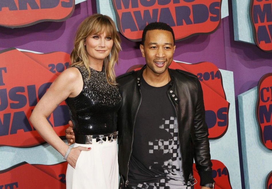 Musicians Jennifer Nettles and John Legend arrive at the 2014 CMT Music Awards in Nashville