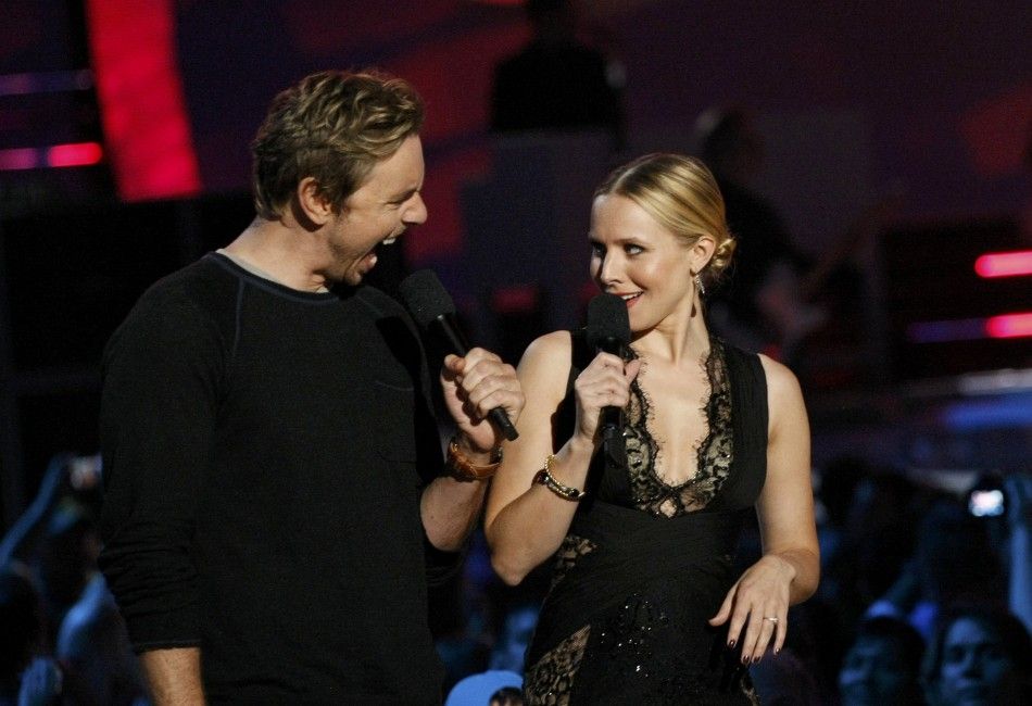 Actor Dax Shepard and his wife, show host Kristen Bell, speak on stage during the 2014 CMT Music Awards in Nashville
