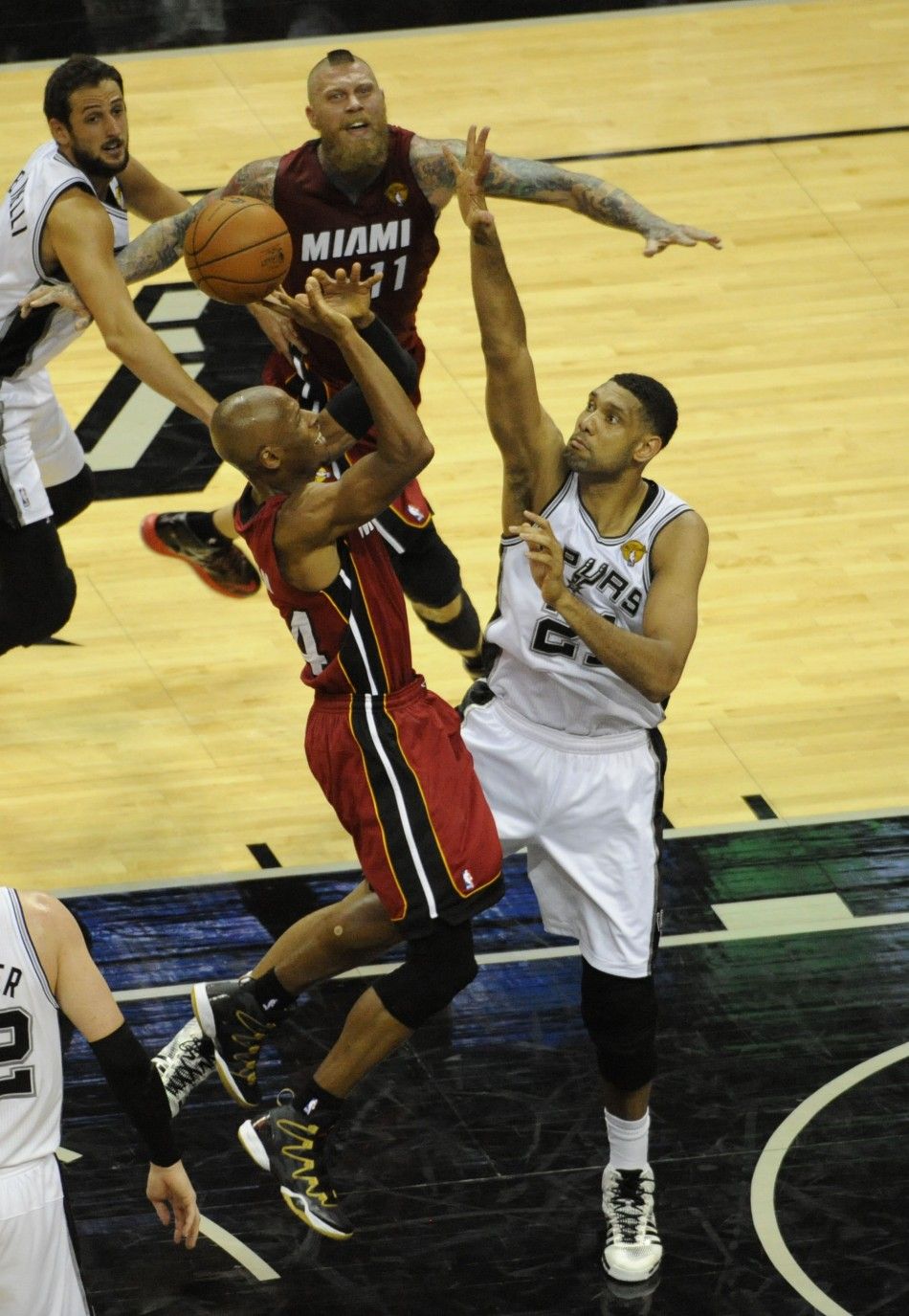 Jun 5, 2014 San Antonio, TX, USA San Antonio Spurs forward Tim Duncan 21 defends in the first half against Miami Heat guard Ray Allen 34 in game one of the 2014 NBA Finals at ATT Center.