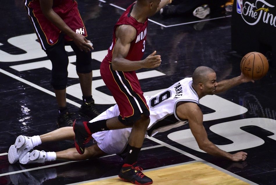 Jun 5, 2014 San Antonio, TX, USA San Antonio Spurs guard Tony Parker 9 dives to try to save the ball in the second half against the Miami Heat in game one of the 2014 NBA Finals at ATT Center. 