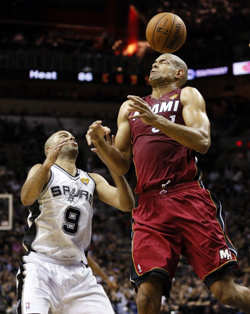 June 5, 2014, San Antonio, TX, USA San Antonio Spurs guard Tony Parker 9 and Miami Heat guard Ray Allen 34 go for a loose ball during the fourth quarter in game one of the 2014 NBA Finals at ATT Center. 