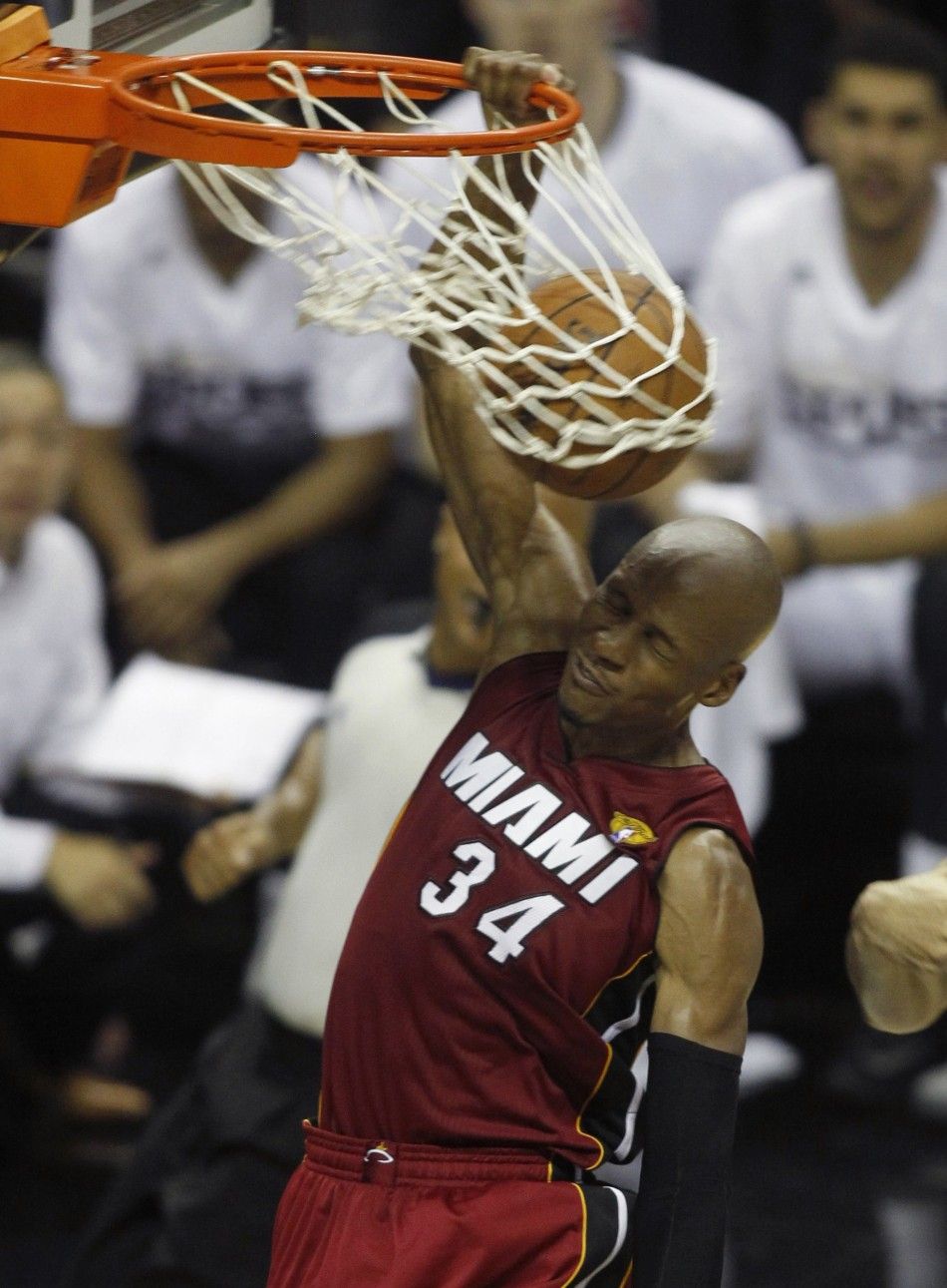 Miami Heats Ray Allen slam dunks against the San Antonio Spurs during the second half in Game 1 of their NBA Finals basketball series in San Antonio, Texas June 5, 2014. 
