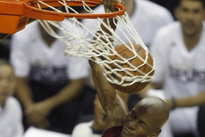 Miami Heat's Ray Allen slam dunks against the San Antonio Spurs during the second half in Game 1 of their NBA Finals basketball series in San Antonio, Texas June 5, 2014. 