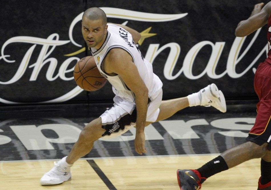 San Antonio Spurs Tony Parker of France dribbles the ball against the Miami Heat in Game 1 of their NBA Finals basketball series in San Antonio, Texas June 5, 2014. 