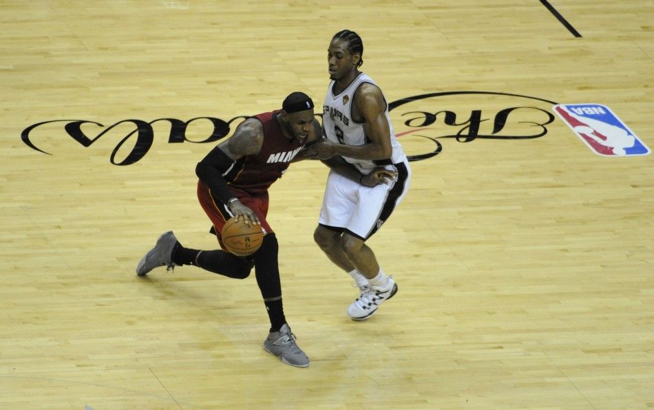 Jun 5, 2014 San Antonio, TX, USA Miami Heat forward LeBron James 6 drives against San Antonio Spurs forward Kawhi Leonard 2 in game one of the 2014 NBA Finals at ATT Center. 