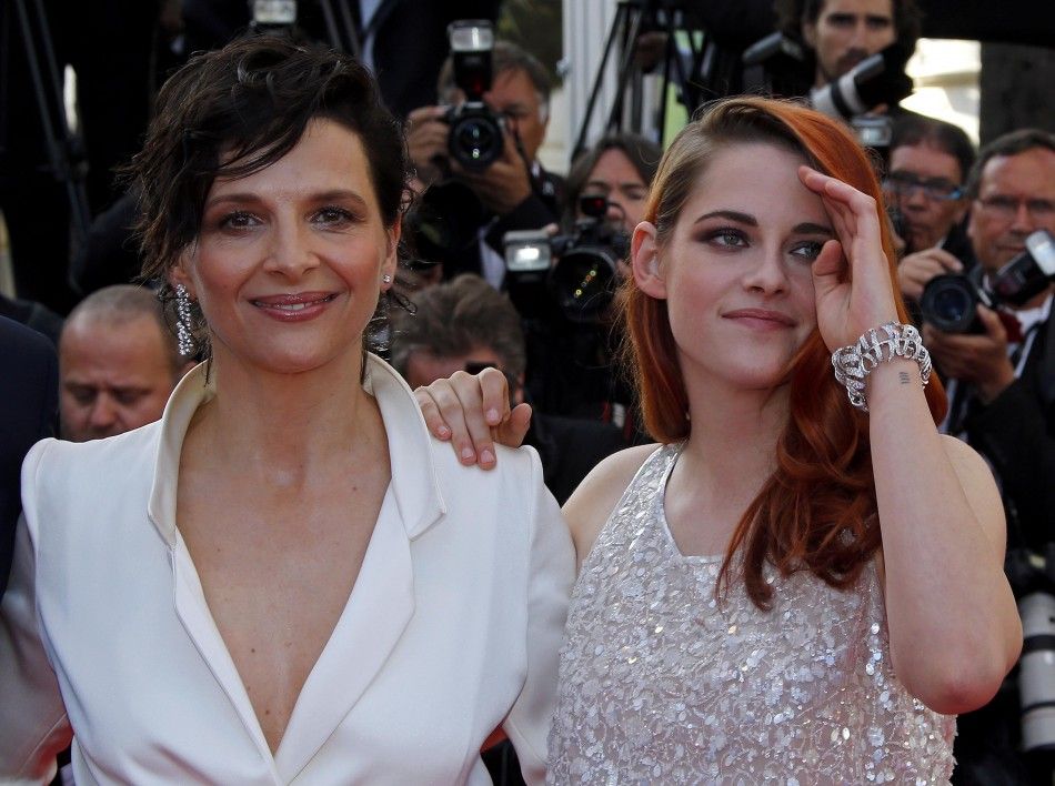 Cast members Juliette Binoche and Kristen Stewart pose on the red carpet as they arrive for the screening of the film quotSils Mariaquot in competition at the 67th Cannes Film Festival in Cannes
