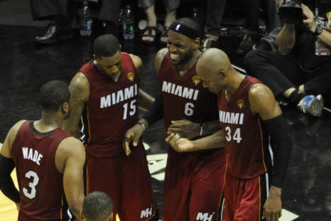 Jun 5, 2014; San Antonio, TX, USA; Miami Heat forward LeBron James (6) reacts after getting injured in the fourth quarter while being helped to the bench against the San Antonio Spurs in game one of the 2014 NBA Finals at AT&T Center. The Spurs beat the H