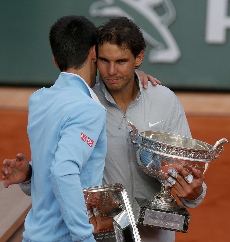 Rafael Nadal of Spain R is congratulated by Novak Djokovic 