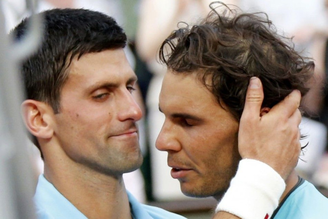 Rafael Nadal of Spain (R) is congratulated by Novak Djokovic of Serbia after winning their men's singles final match to win the French Open Tennis tournament at the Roland Garros stadium in Paris June 8, 2014. 