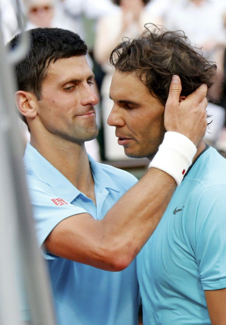 Rafael Nadal of Spain (R) is congratulated by Novak Djokovic of Serbia after winning their men's singles final match to win the French Open Tennis tournament at the Roland Garros stadium in Paris June 8, 2014. 
