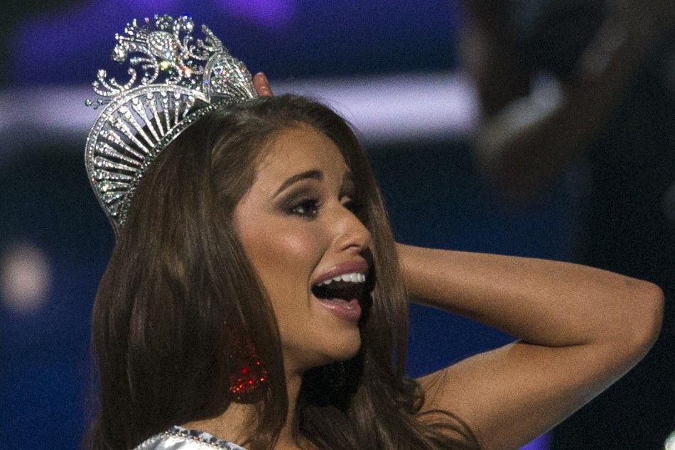 Miss Nevada Nia Sanchez reacts after winning the 2014 Miss USA beauty pageant in Baton Rouge, Louisiana June 8, 2014.