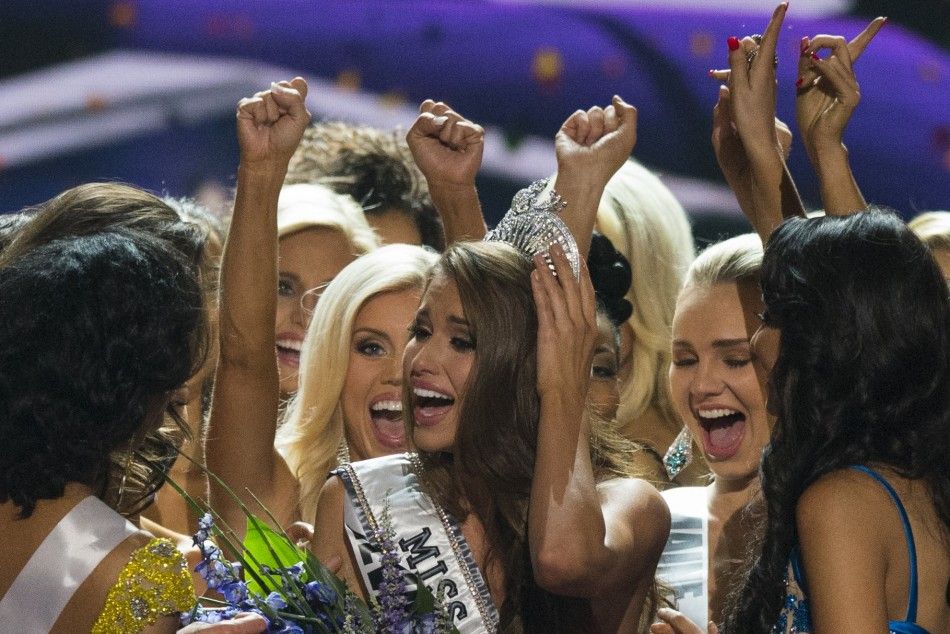 Fellow contestants celebrate with Miss Nevada Nia Sanchez after she won the 2014 Miss USA beauty pageant in Baton Rouge, Louisiana June 8, 2014.