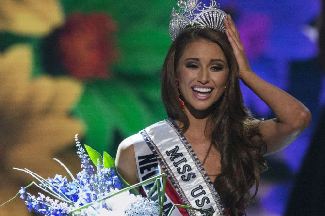 Miss Nevada Nia Sanchez reacts after winning the 2014 Miss USA beauty pageant in Baton Rouge, Louisiana June 8, 2014. Fifty-one state titleholders compete in the swimsuit, evening gown and interview categories for the title of Miss USA 2014 during the 63r