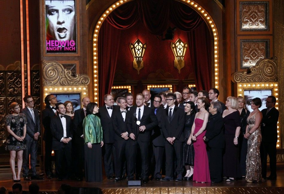 Producer David Binder C accepts the Award for Best Revival of a Musical with the cast and crew of quotHedwig and the Angry Inchquot during the American Theatre Wings 68th annual Tony Awards at Radio City Music Hall in New York, June 8, 2014. 