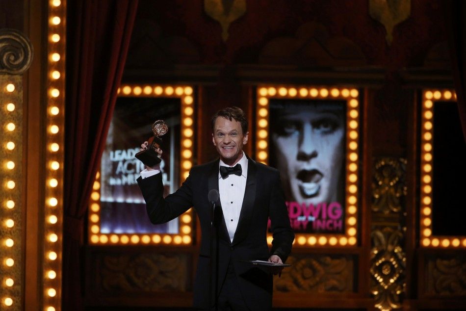 Neil Patrick Harris accepts the award for Best Performance by an Actor in a Leading Role in a Musical for quotHedwig and the Angry Inchquotduring the American Theatre Wings 68th annual Tony Awards at Radio City Music Hall in New York, June 8, 2014. 