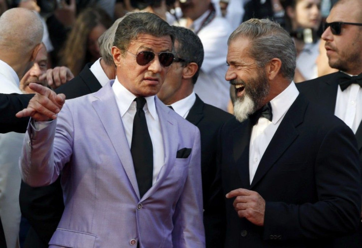 Actors Sylvester Stallone and Mel Gibson, cast members of the film &quot;The Expendables 3&quot;, pose on the red carpet during the 67th Cannes Film Festival in Cannes