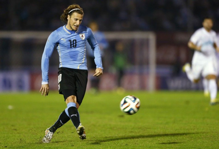 Uruguay&#039;s Diego Forlan kicks the ball during an international friendly soccer match against Slovenia in Montevideo