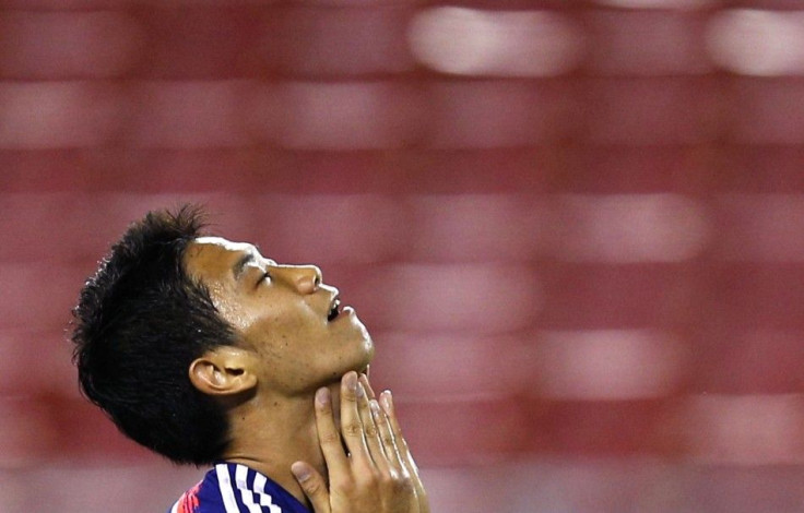 Japan&#039;s Shinji Kagawa reacts after his missed kick during their international friendly soccer match against Zambia, ahead of the 2014 World Cup, in Tampa