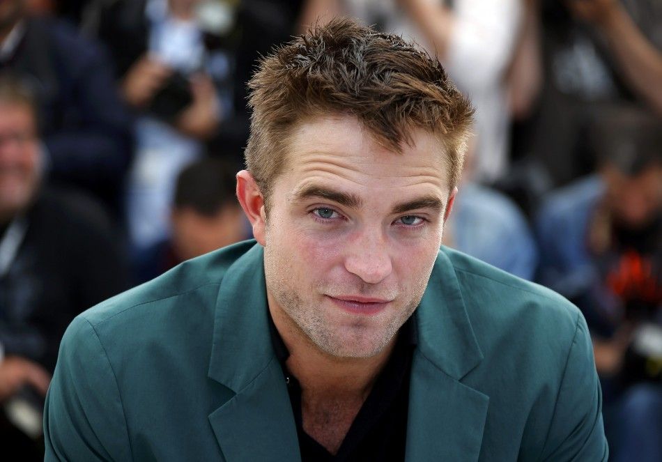 Cast member Robert Pattinson poses during a photocall for the film quotThe Roverquot out of competition at the 67th Cannes Film Festival in Cannes May 18, 2014.           REUTERSEric Gaillard