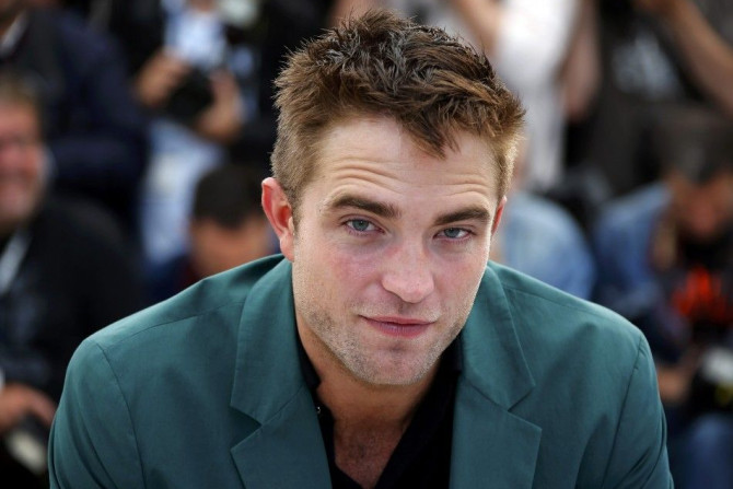Cast member Robert Pattinson poses during a photocall for the film &quot;The Rover&quot; out of competition at the 67th Cannes Film Festival in Cannes May 18, 2014.           REUTERS/Eric Gaillard