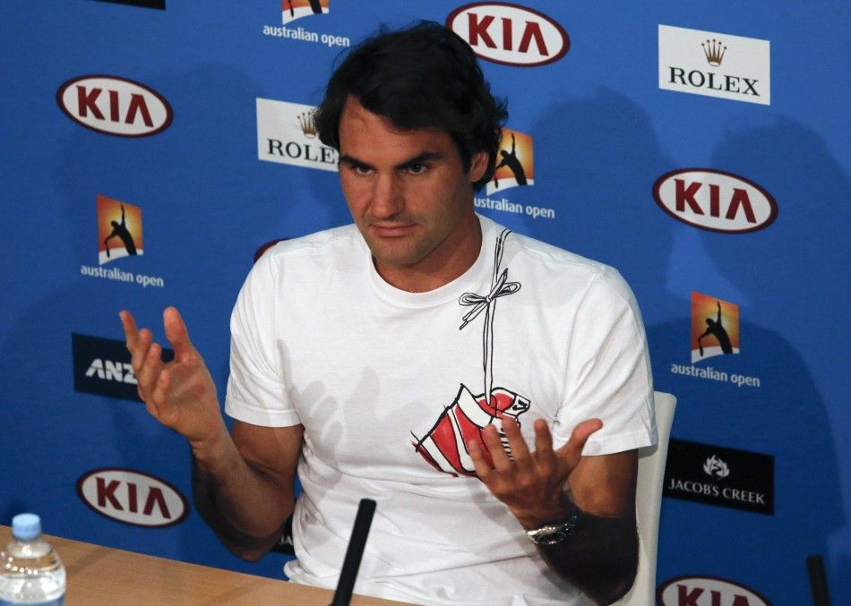 Roger Federer of Switzerland reacts during a news conference after his mens singles semi-final match against Rafael Nadal of Spain  at the Australian Open 2014 tennis tournament in Melbourne January 24, 2014. REUTERSDavid Gray 