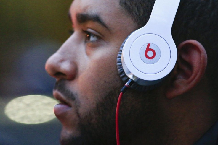 A Man Listens to Beats Brand Headphones on a Street in New York