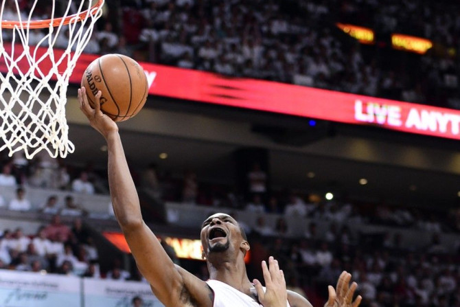 Jun 12, 2014; Miami, FL, USA; Miami Heat center Chris Bosh (1) drives to the basket against San Antonio Spurs guard Danny Green (4) during the first quarter of game four of the 2014 NBA Finals at American Airlines Arena.