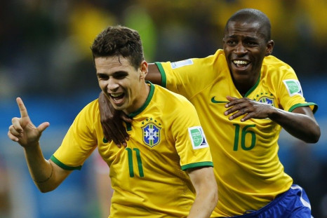 Brazil's Oscar (L) and Ramires celebrate during the 2014 World Cup opening match between Brazil and Croatia at the Corinthians arena in Sao Paulo