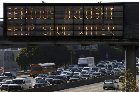 A Caltrans information sign urges drivers to save water due to the California drought emergency in Los Angeles, California in this February 13, 2014 file photo. As California struggles through its third year of drought, nearly half of state residents said