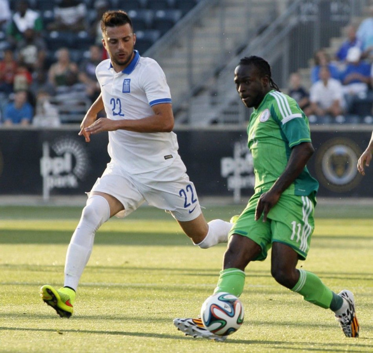 Nigeria&#039;s Moses looks to pass, next to Greece&#039;s Samaris, during their international friendly soccer match in Chester