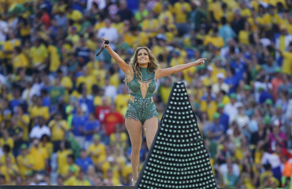 Singer Jennifer Lopez gestures as she performs during the opening ceremony of the 2014 World Cup at the Corinthians arena in Sao Paulo