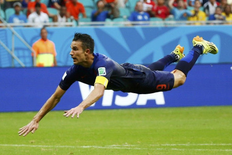 Robin van Persie of the Netherlands heads to score against Spain during their 2014 World Cup Group B soccer match at the Fonte Nova arena in Salvador