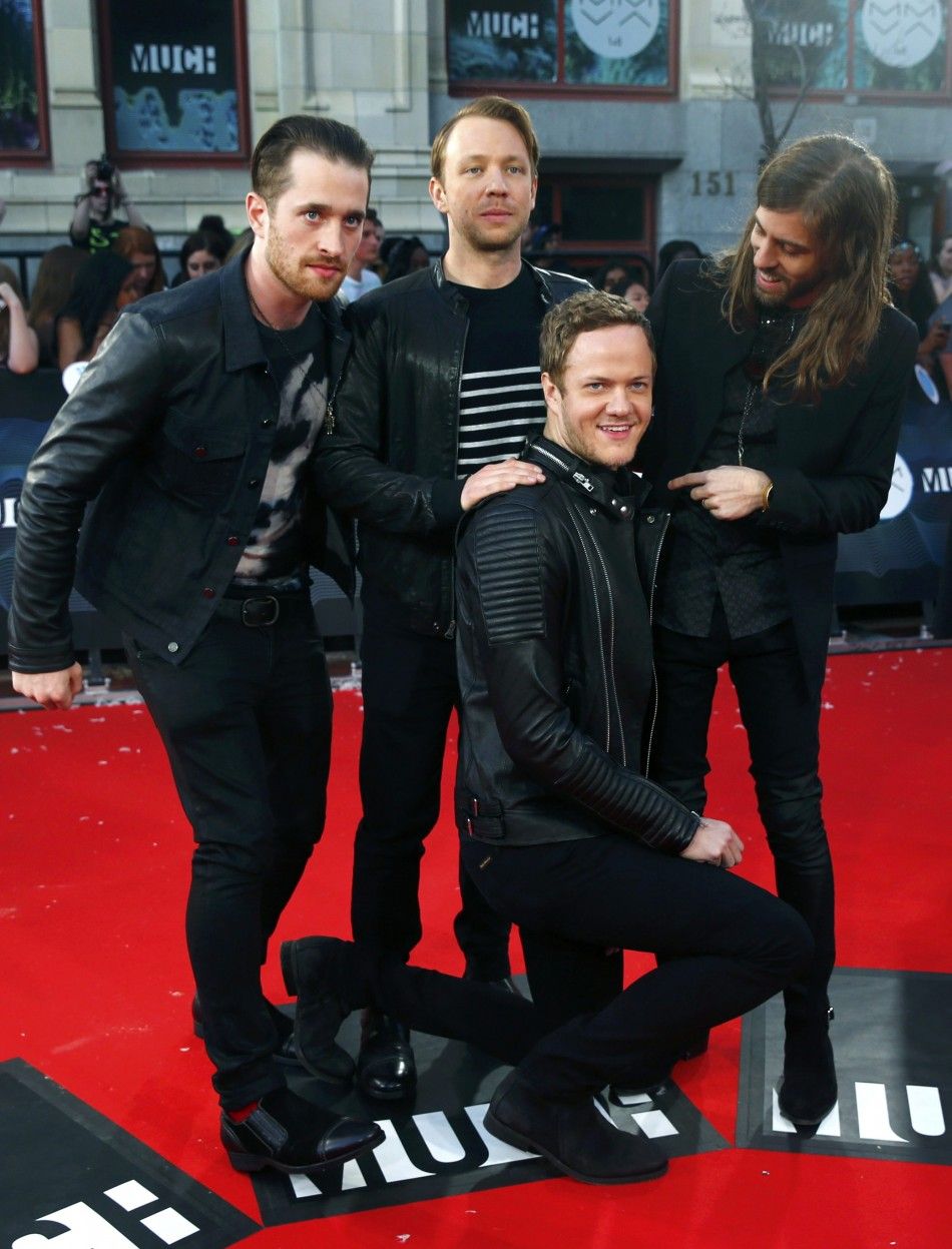 Members of the band Imagine Dragons pose on the red carpet at the MuchMusic Video Awards MMVA in Toronto