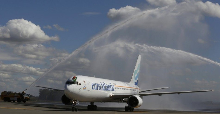 The airplane with Portugal's national soccer team is given a traditional water cannon salute by the fire tenders upon its arrival at the Viracopos airport ahead of the 2014 World Cup, in Campinas near Sao Paulo June 11, 2014. REUTERS/Nacho Doce (BRAZIL - 