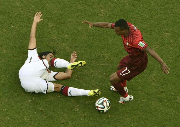 Germany's Sami Khedira fights for the ball with Portugal's Nani during their 2014 World Cup Group G soccer match at the Fonte Nova arena in Salvador June 16, 2014. 