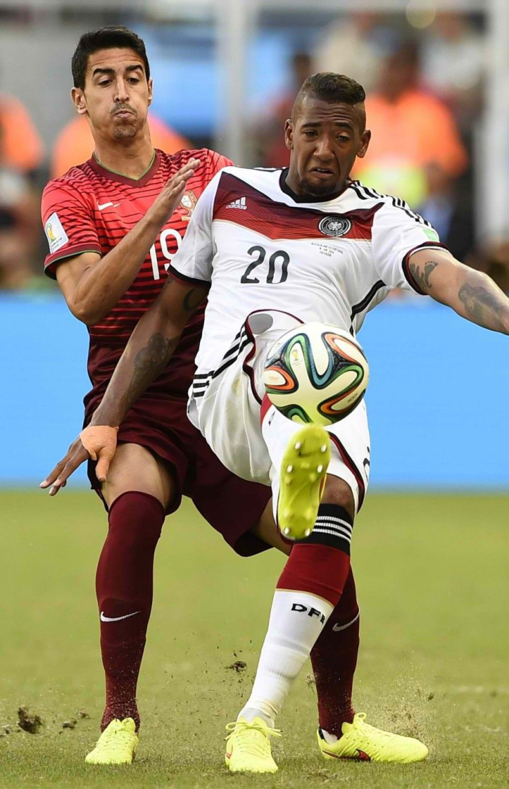 Germany's Jerome Boateng (20) kicks the ball next to Portugal's Andre Almeida during their 2014 World Cup Group G soccer match at the Fonte Nova arena in Salvador, June 16, 2014. 