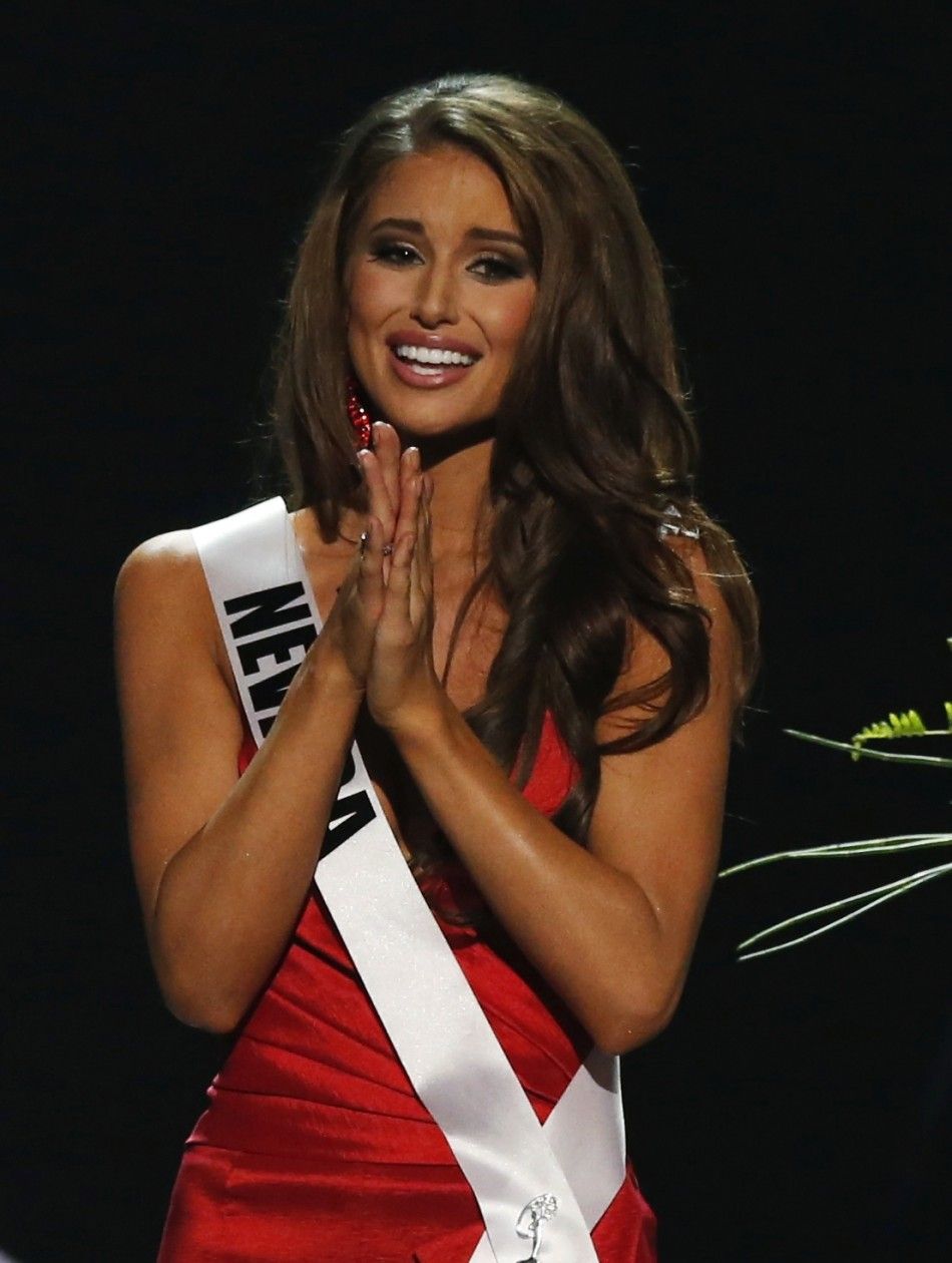 Miss Nevada Nia Sanchez reacts to winning the 2014 Miss USA beauty pageant in Baton Rouge, Louisiana June 8, 2014. Fifty-one state titleholders compete in the swimsuit, evening gown and interview categories for the title of Miss USA 2014 during the 63rd a