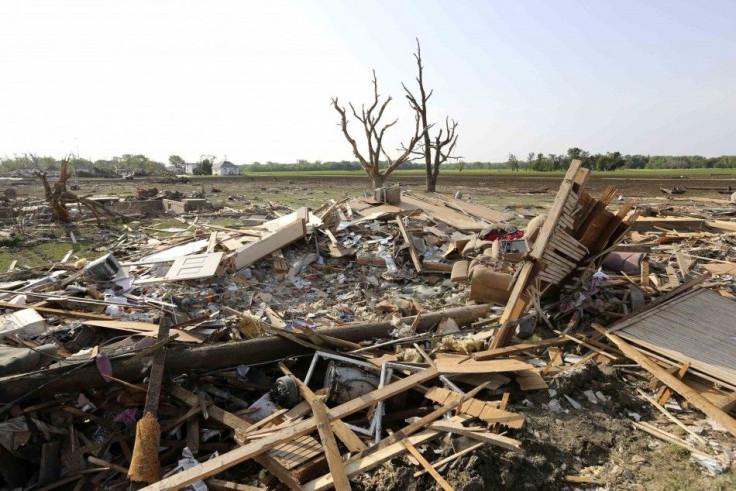 Debris is pictured in the town of Pilger, Nebraska June 17, 2014. Residents who were forced to leave a Nebraska village leveled by a tornado that killed a child and injured more than two dozen people began returning on Tuesday to salvage belongings from t