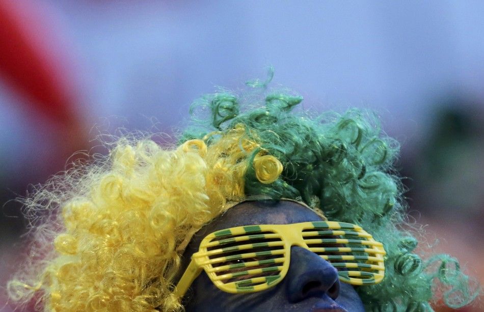 A soccer fan watches the 2014 World Cup
