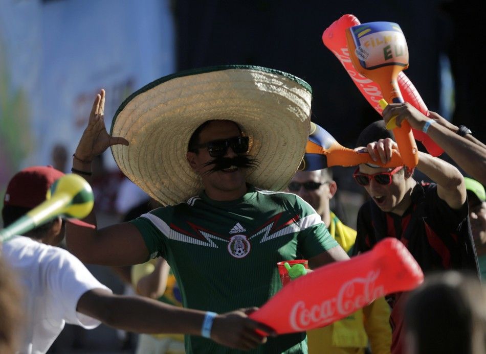 A soccer fan wearing a Mexican hat 