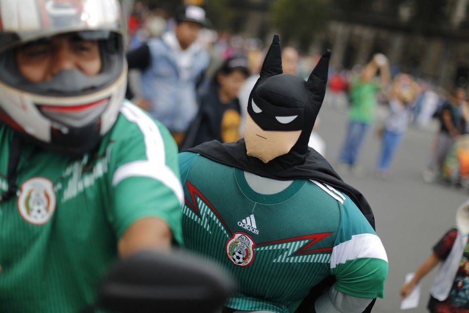 A Mexican soccer fan who brought along a stuffed doll dressed up as Batman 