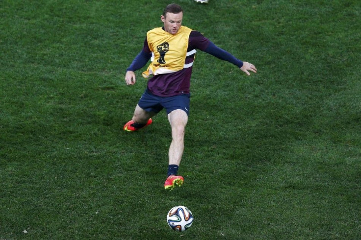 England's Wayne Rooney attends a training session at the Corinthians arena at Sao Paulo city, June 18, 2014.    REUTERS/Ivan Alvarado