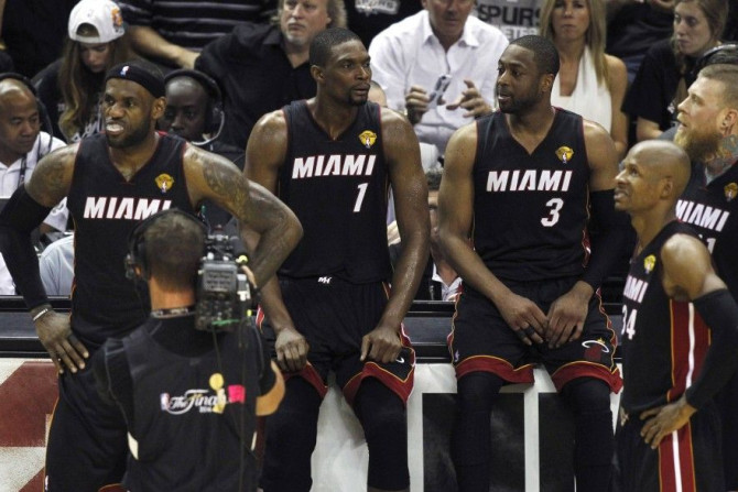 Miami Heat's (L-R) LeBron James, Chris Bosh, Dwyane Wade, Ray Allen and Chris Andersen wait to enter the game against the San Antonio Spurs during the third quarter in Game 5 of their NBA Finals basketball series in San Antonio, Texas, June 15, 2014.