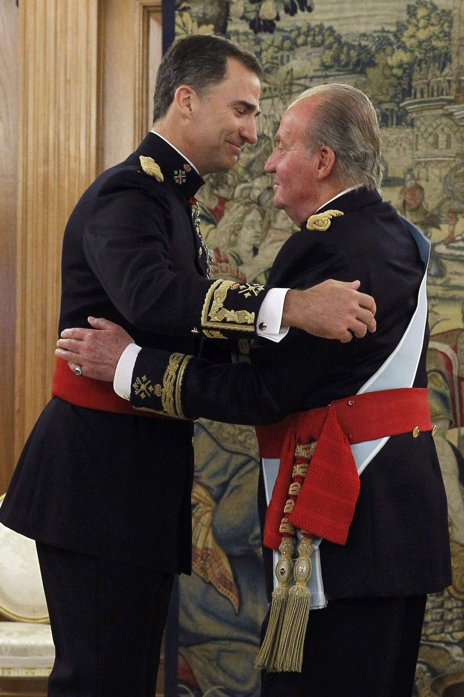 Spains King Juan Carlos R and new King Felipe VI 