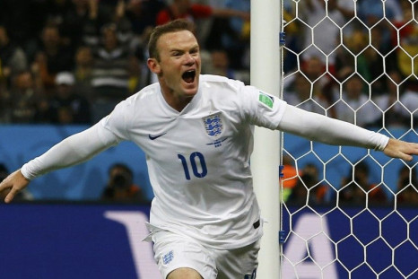 England&#039;s Rooney celebrates scoring against Uruguay during their 2014 World Cup Group D soccer match at the Corinthians arena in Sao Paulo